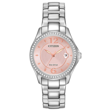 Ladies Citizen Watch FE1140-86X. This Silhouette model is shown in a stainless steel case and band, crystal accent bezel, and a pink dial with a date window. Features include: Eco-Drive technology, luminous hands, mineral crystal, and water resistance up to 50 meters. 