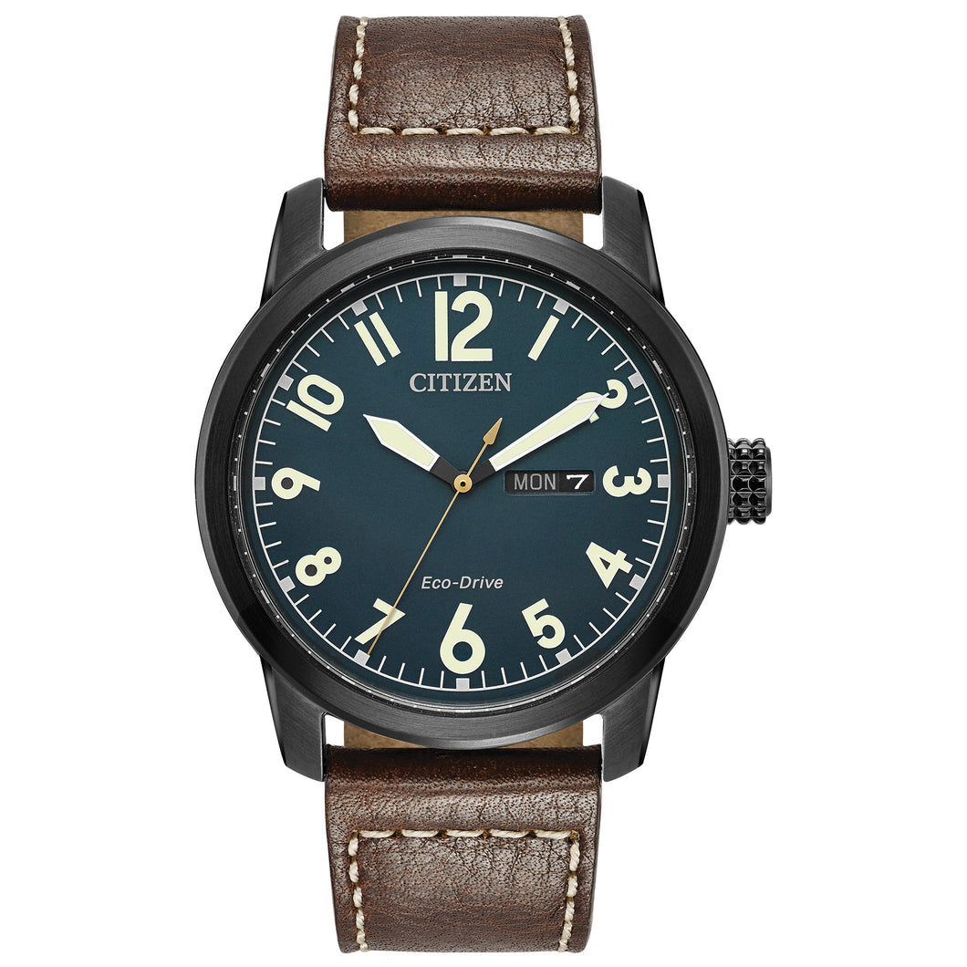 Gents Citizen Watch BM8478-01L. This military inspired piece is shown in a black ion-plated stainless steel case, dark brown strap with contrast stitching, and a teal dial with a day and date window. Features include: Eco-Drive technology, luminous hands and markers, and up to 100 meter water resistance. 