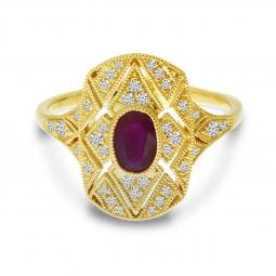 14 karat yellow gold ruby and diamond art deco ring containing one oval 0.60ct ruby with 0.23cttw round diamonds.