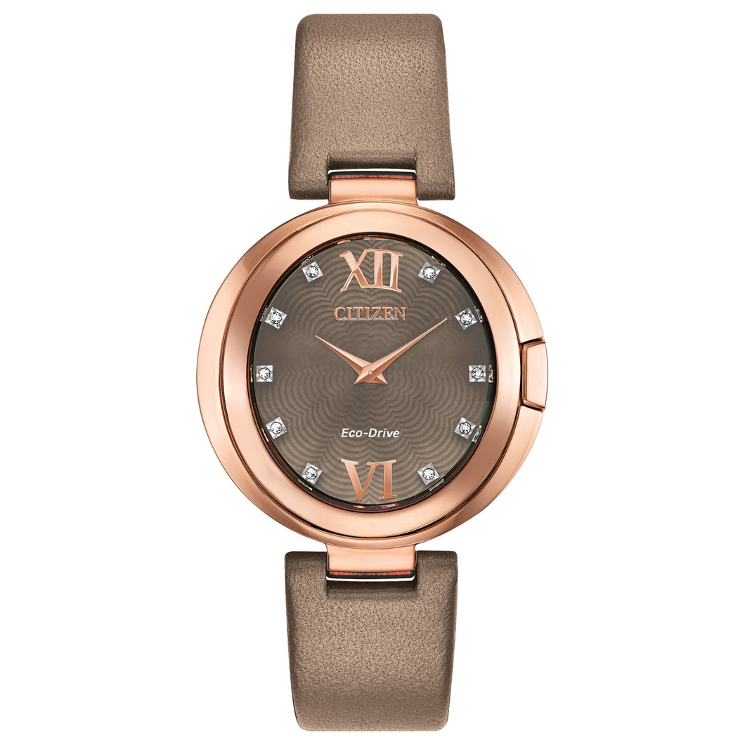 Ladies Citizen Watch EX1513-00Y. This Capella model is shown in a a rose gold-tone stainless steel case, a beige strap, and a gray brown Mother-of-Pearl dial with diamond accent. Features include: Eco-Drive technology, sapphire crystal, and water resistance up to 50 meters.